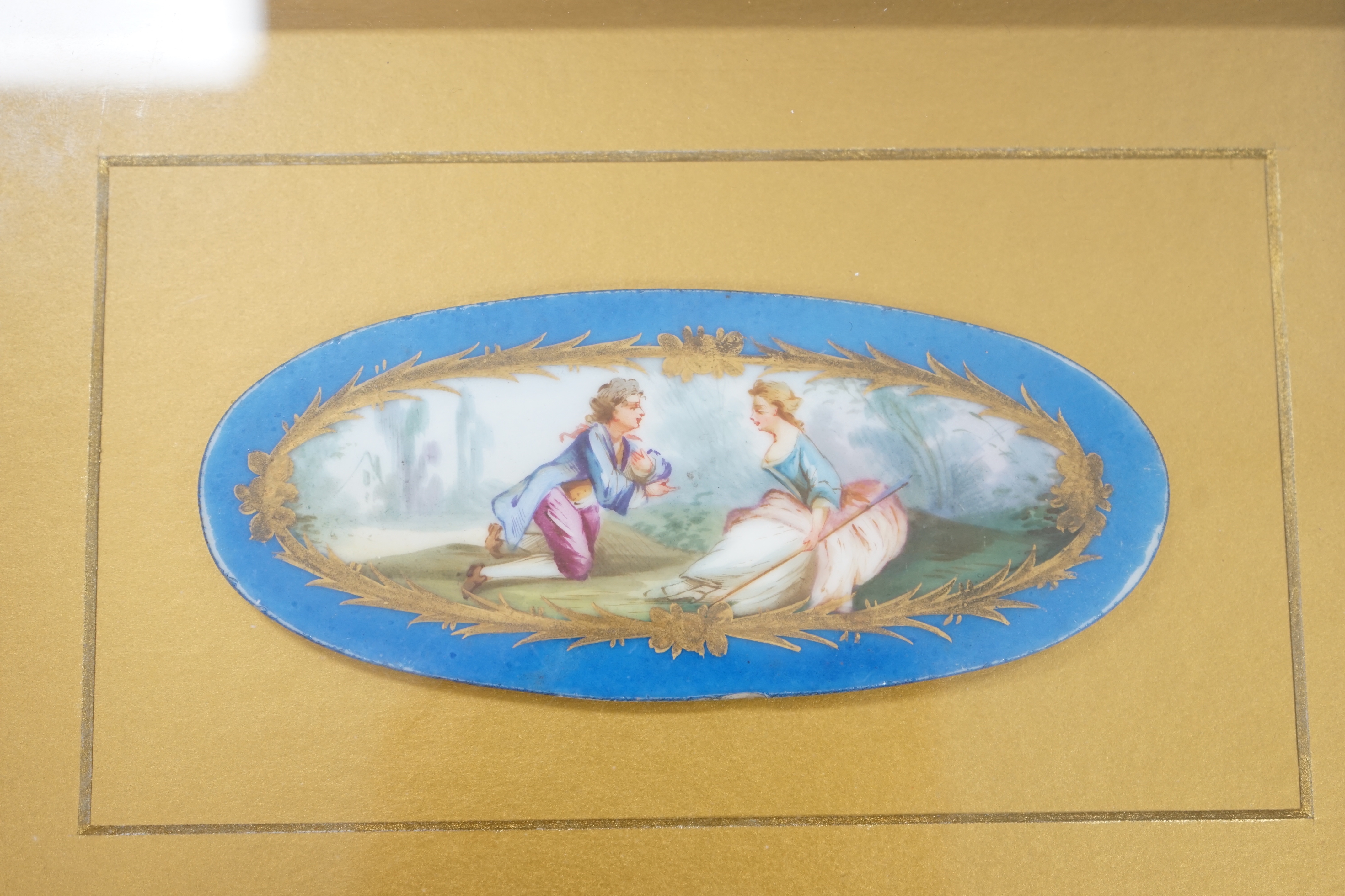 A pair of framed Sevres style porcelain oval plaques and a papier mache panel, inscribed verso and dated 1797, pair 26cm x 18cm